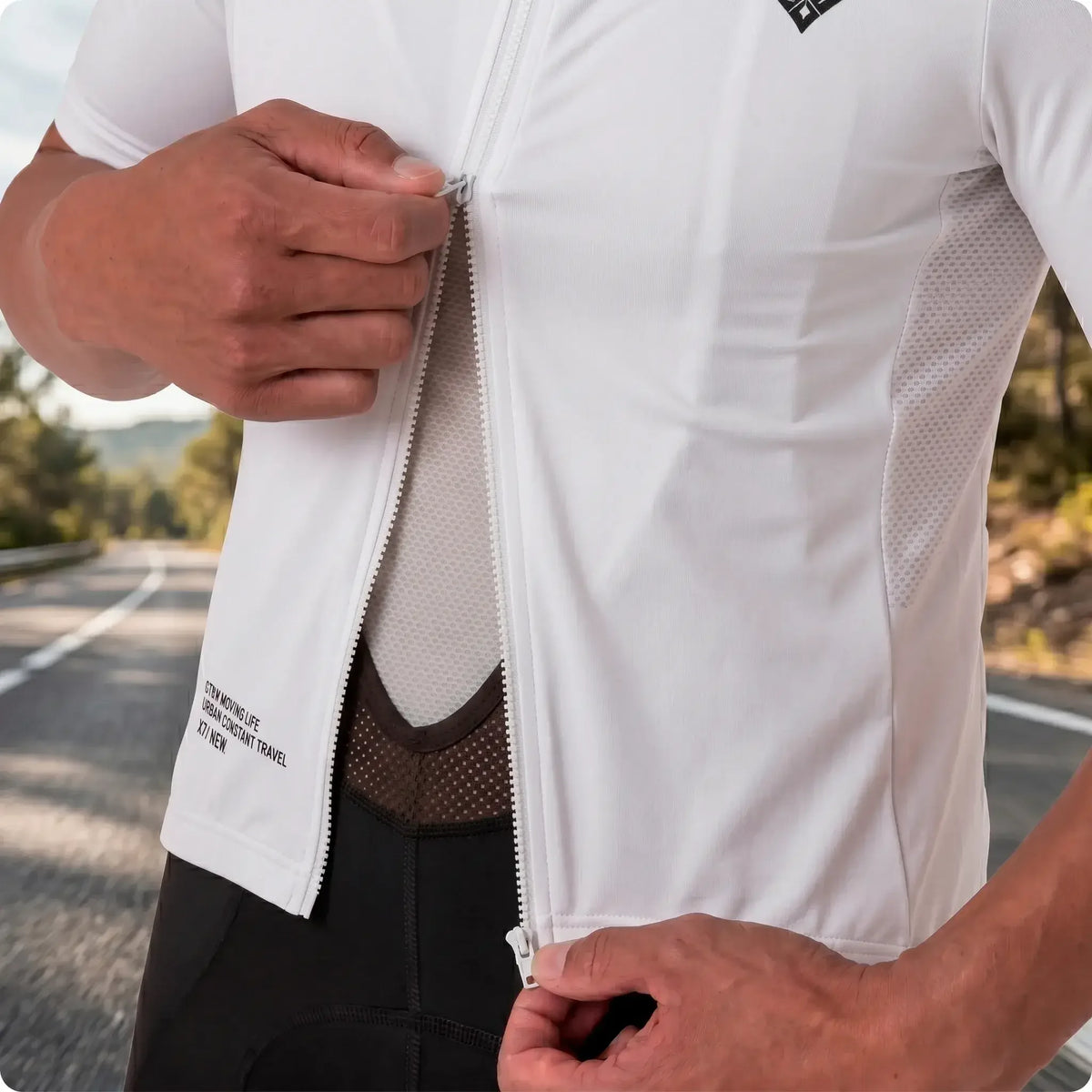 White cycling jersey with zipper and mesh panels for breathability on outdoor ride