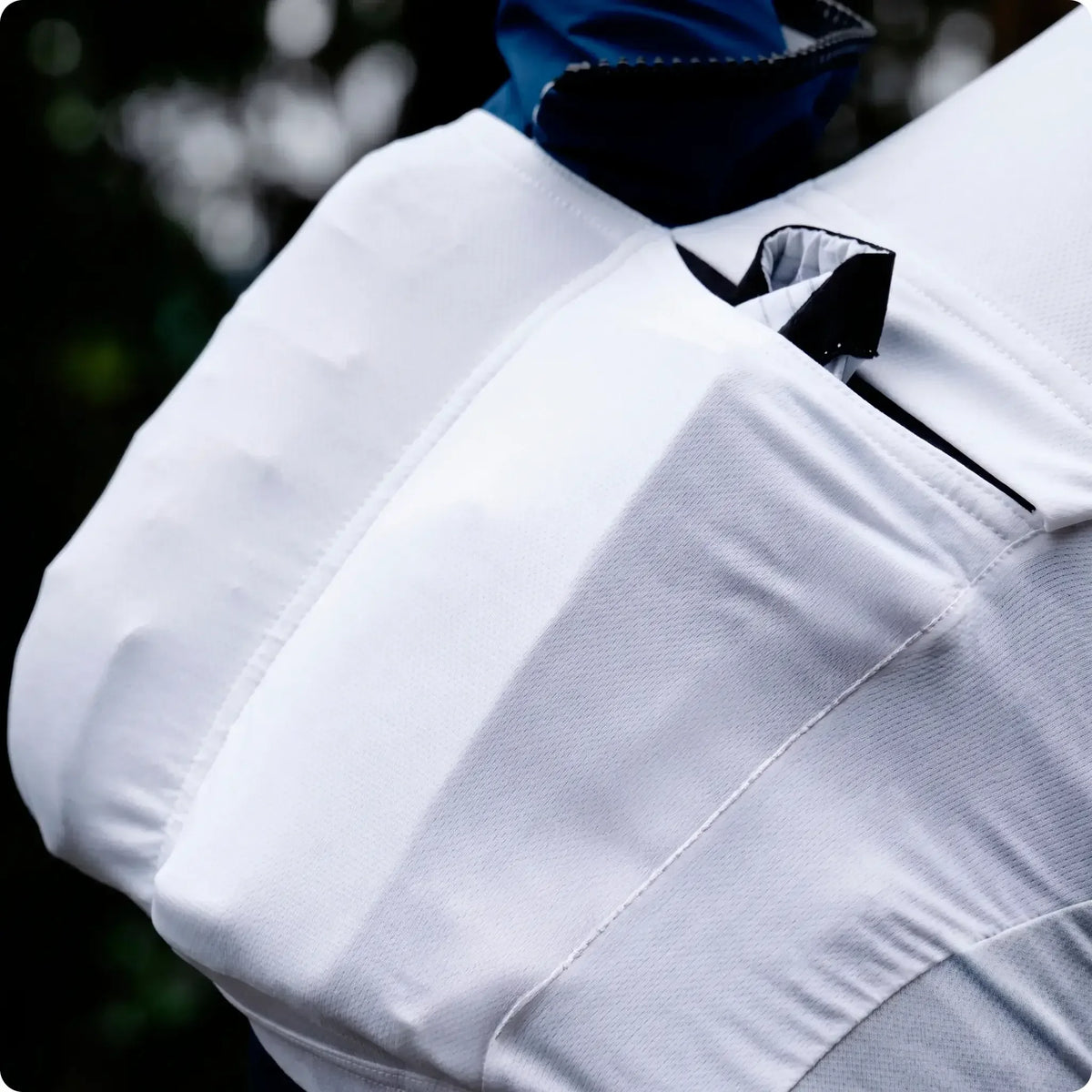 White athletic jacket with blue hood and black zipper details