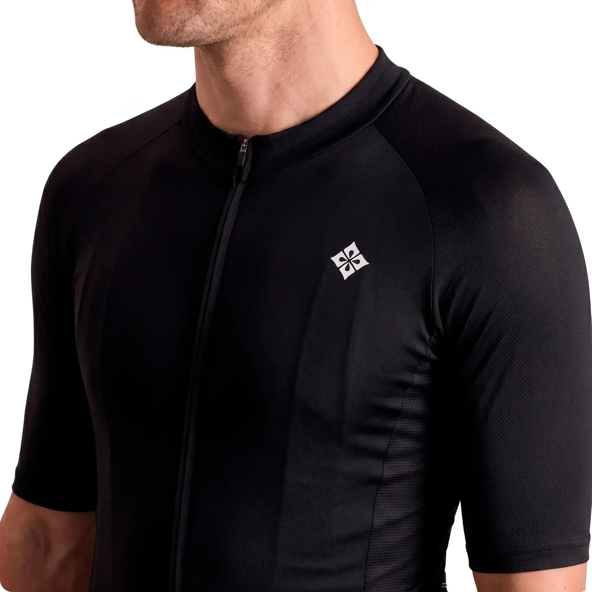 Black cycling jersey with white logo, short sleeves, and front zipper