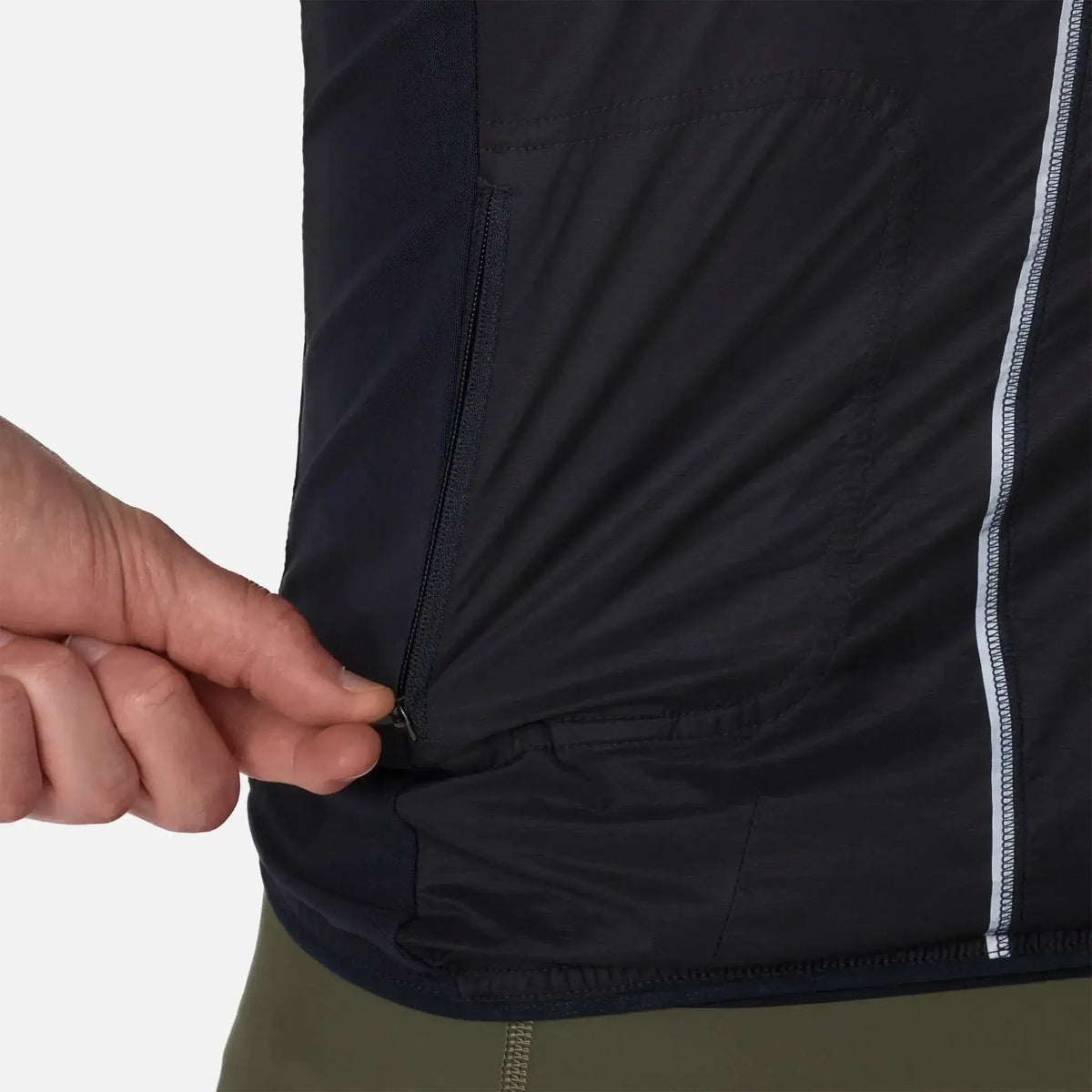 Black running vest with zippered side pocket and reflective stripe, ideal for trail or gym workouts