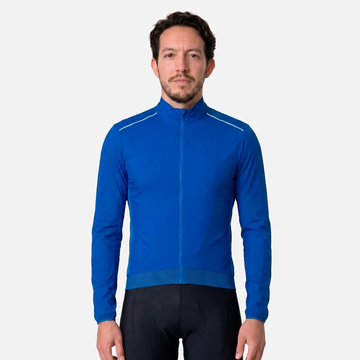 Man wearing blue cycling jacket with white accents and black padded shorts