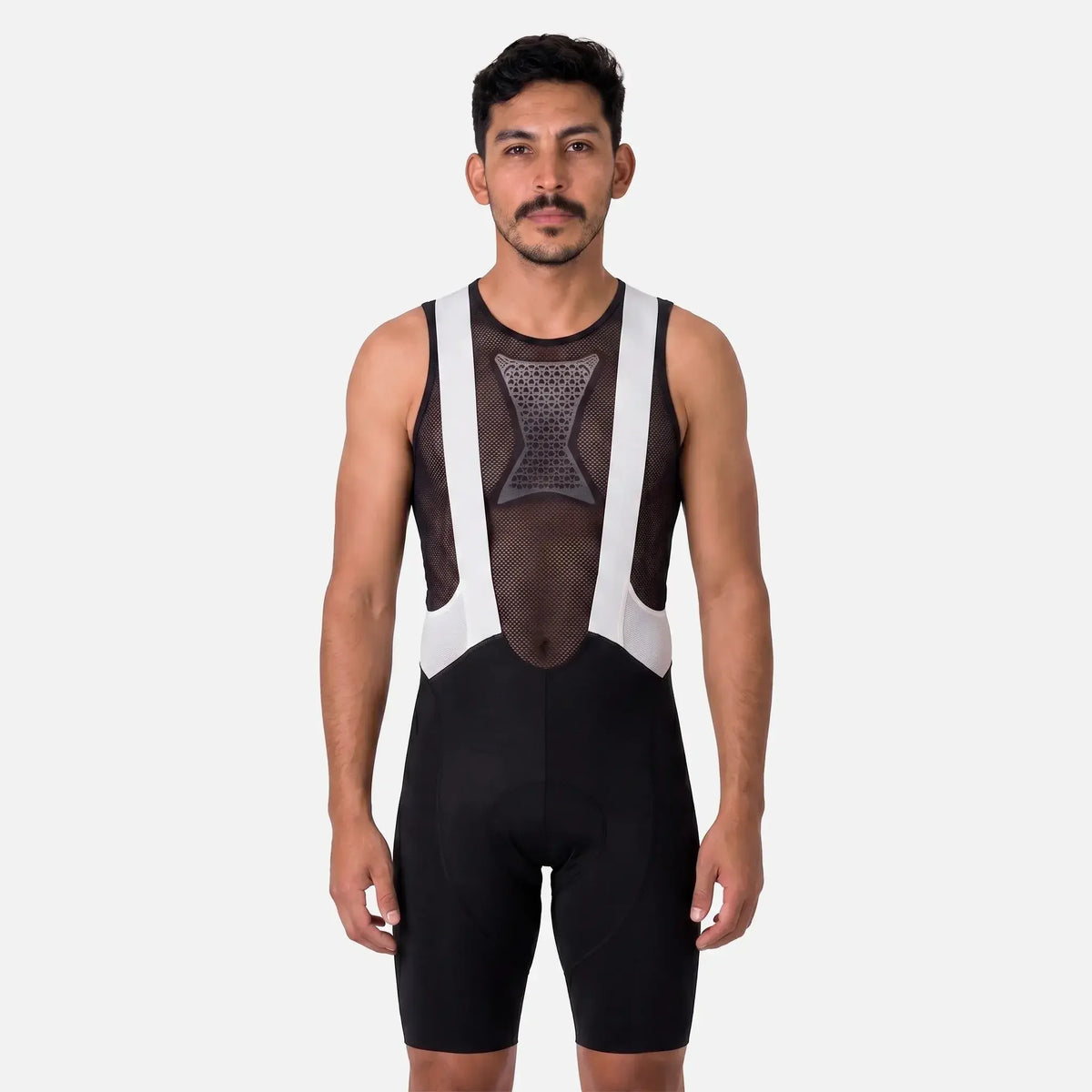 Man wearing black and white cycling bib shorts with mesh panel design