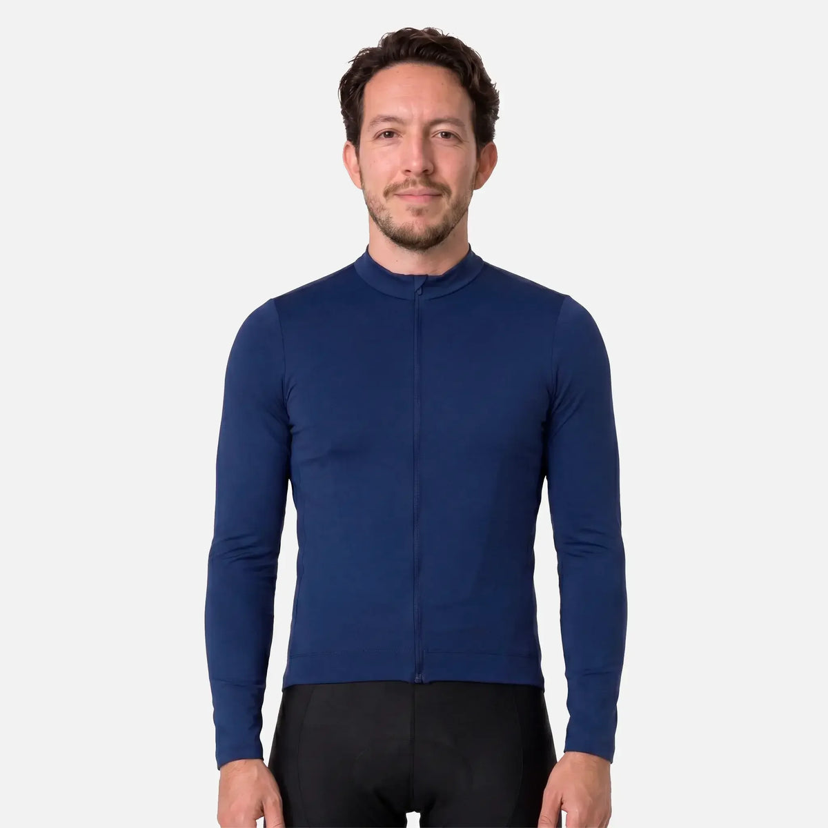 Man wearing navy blue long-sleeve cycling jersey with full zipper