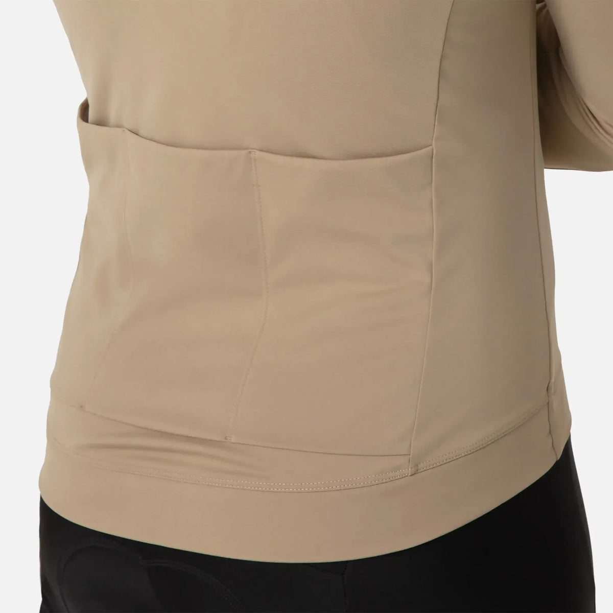 Beige athletic top with back pockets and sleek stitching design